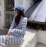 Autumn style temperament small fragrance stripe knitted long-sleeved cardigan suspender dress women's Korean version slim two-piece dress